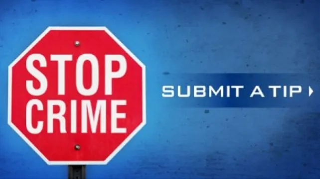 Red stop sign with "STOP CRIME" text, blue background, "SUBMIT A TIP" text on the right